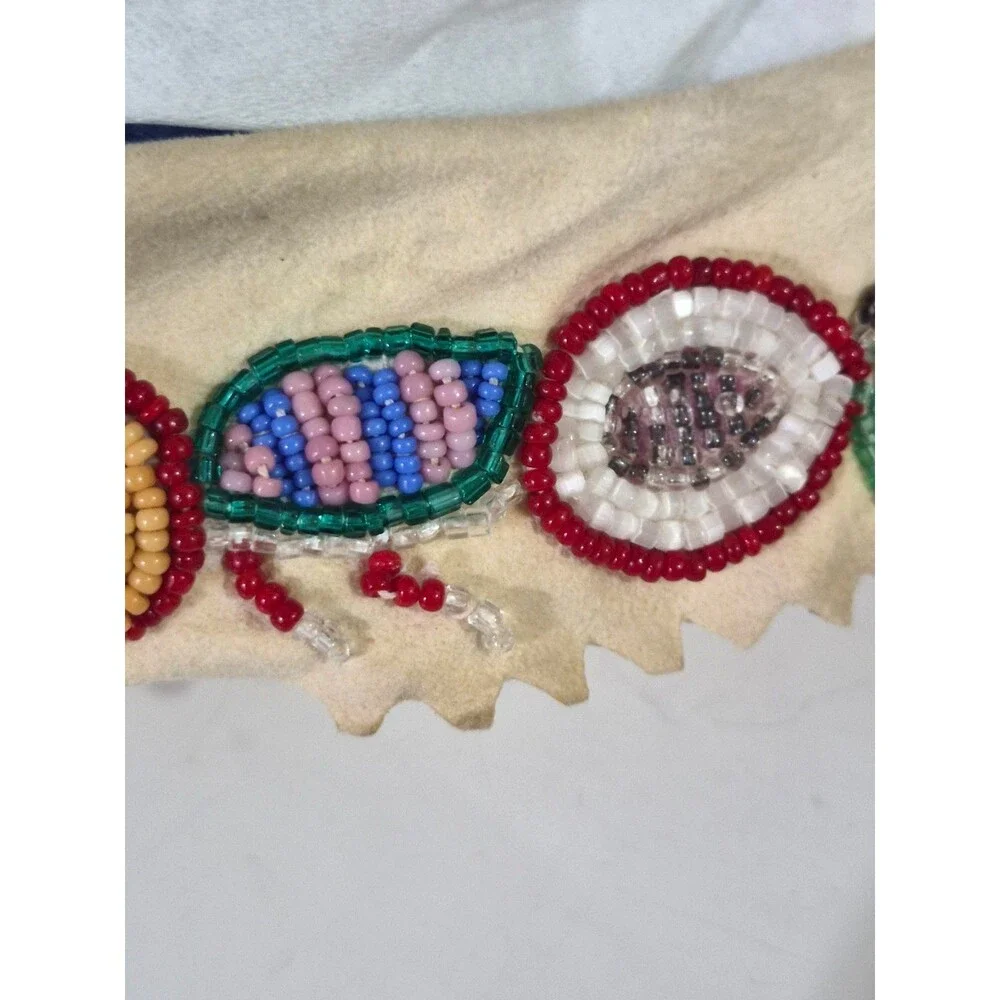 Vintage Crow Beaded Hide Moccasins featuring Intricate Colorful Glass Beadwork